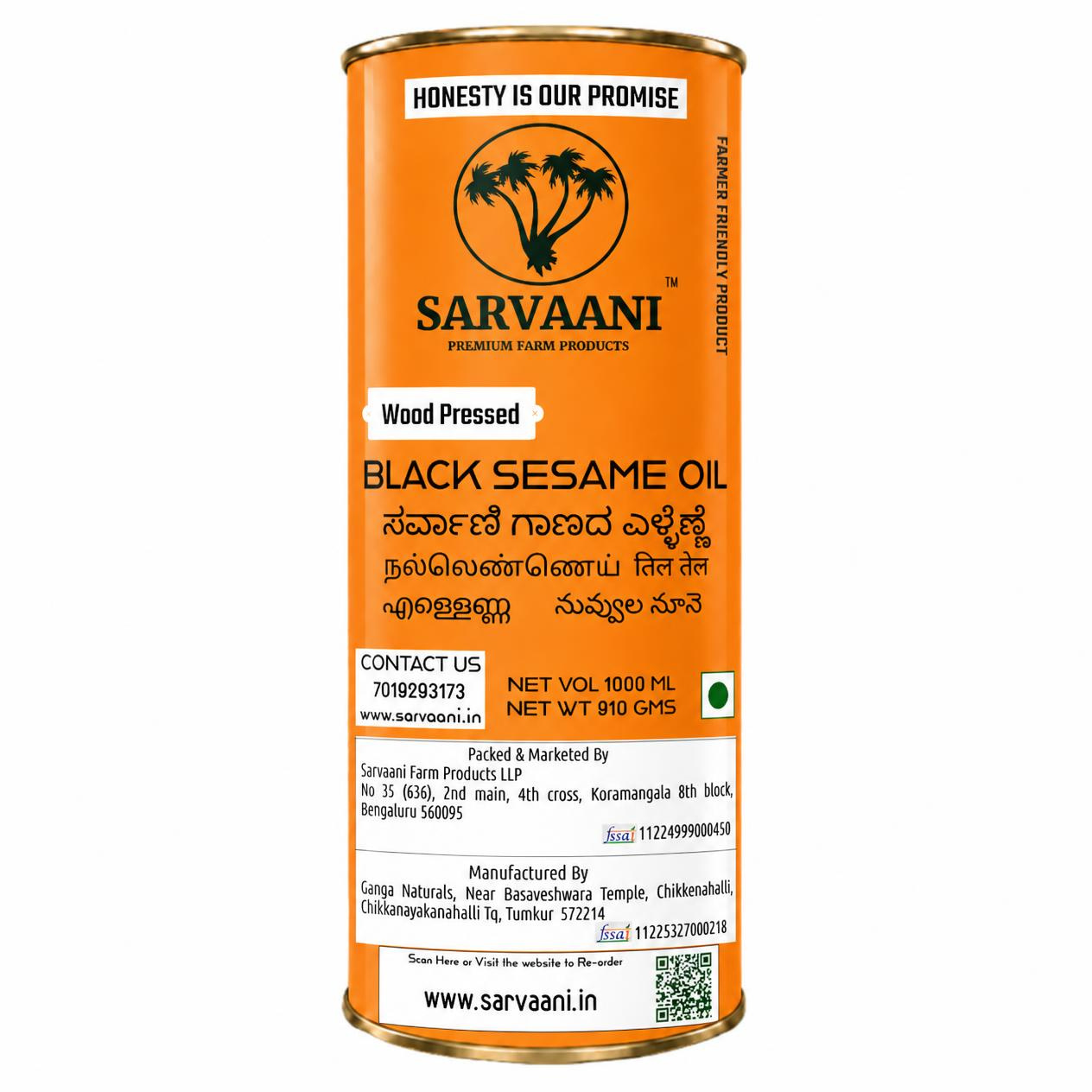 A tall cylindrical metal can of Sarvaani Black Sesame Oil on a plain white background. The label is predominantly orange with black text and a black circular logo featuring three palm trees.