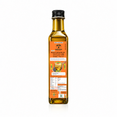 A bottle of Marigold Black Sesame Oil, 500ml, shown from the back against a white background. The bottle is filled with golden-yellow oil and features a black screw cap and an orange label with product details. Sarvaani Sesame Oil