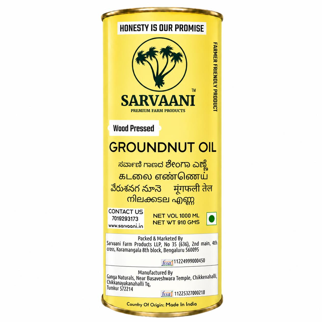A cylindrical yellow metal tin of Sarvaani Groundnut Oil, featuring a white and black label with text in English, Hindi, and Sanskrit, on a plain white background.