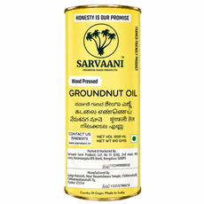 A cylindrical yellow metal tin of Sarvaani Groundnut Oil, featuring a white and black label with text in English, Hindi, and Sanskrit, on a plain white background.