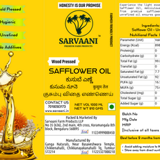 A bright yellow label for Sarvaani Wood Pressed Safflower Oil, featuring the brand logo, product details, nutritional facts, and illustrations of a palm tree and a cow.
