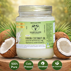 Jar of Sarvaani Virgin Coconut Oil with coconuts on a wooden surface and greenery in the background