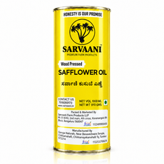 A tall cylindrical metal can of Sarvaani Wood Pressed Safflower Oil, featuring a bright yellow label with black text and logo, set against a plain white background with a subtle reflection.