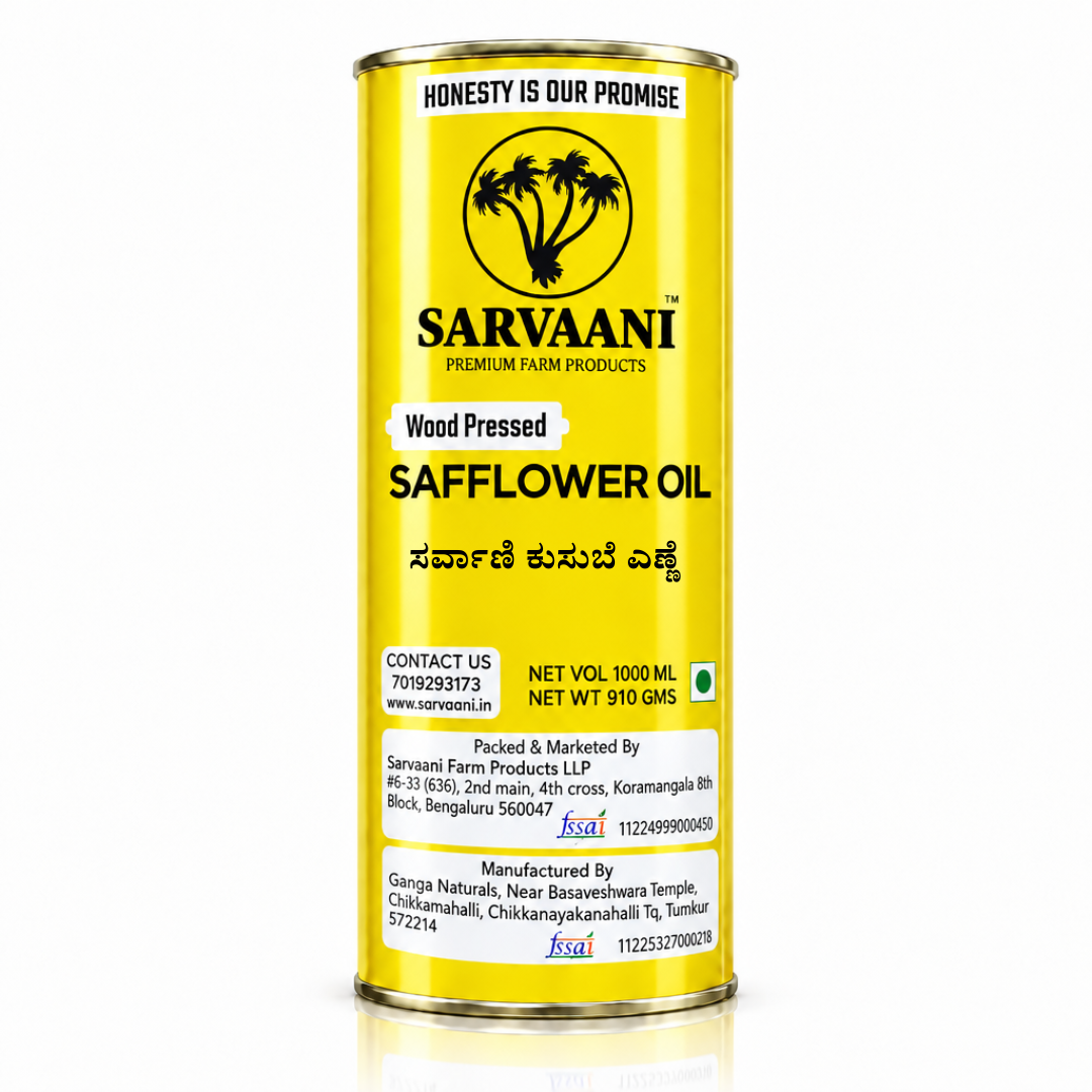 A tall cylindrical metal can of Sarvaani Wood Pressed Safflower Oil, featuring a bright yellow label with black text and logo, set against a plain white background with a subtle reflection.