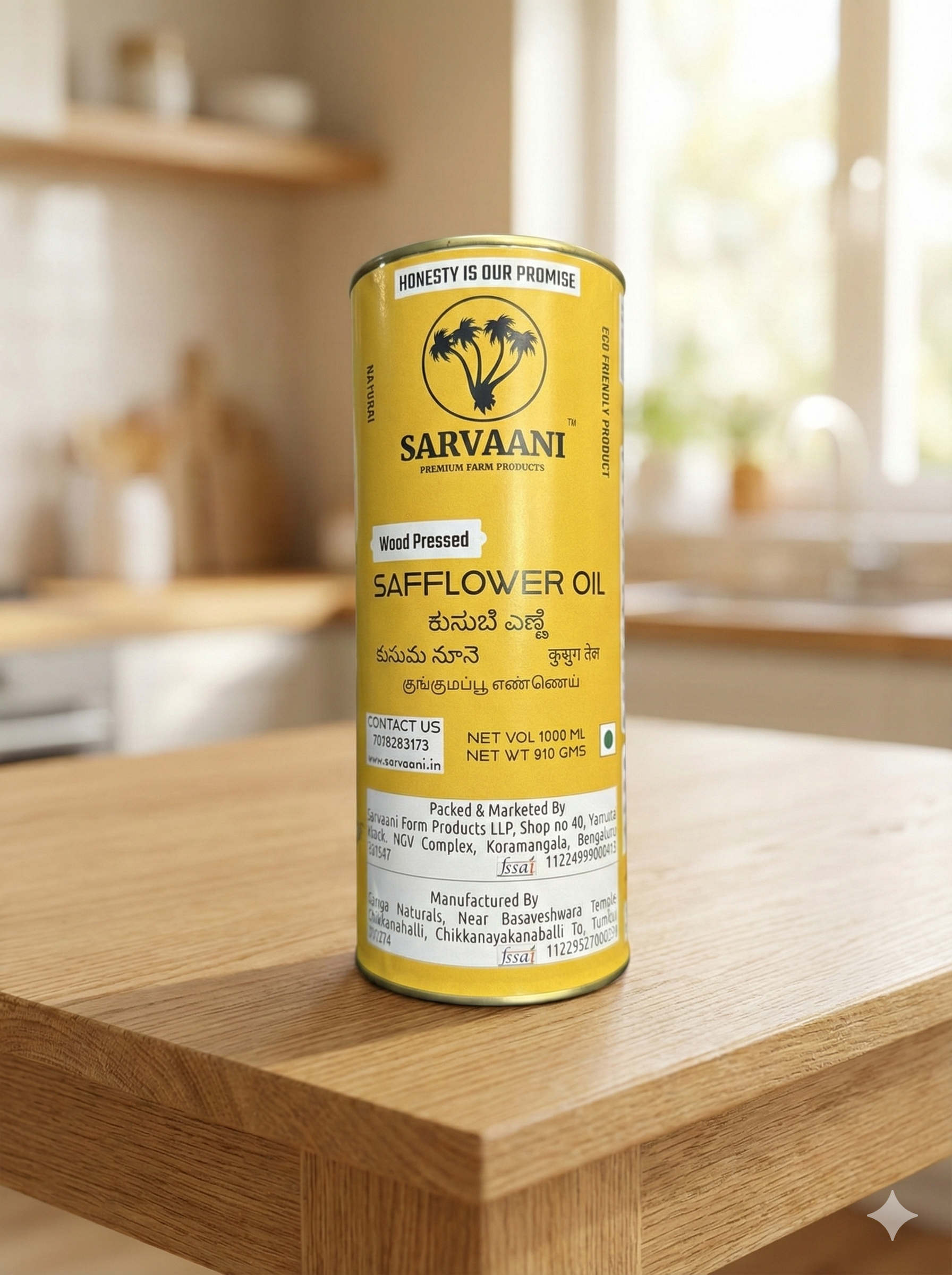 Can of Sarvaani safflower oil on a wooden surface with a blurred kitchen background
